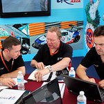 Danny Watts and engineer Trevor Foster in post-session debrief while a McLaren technician studies data